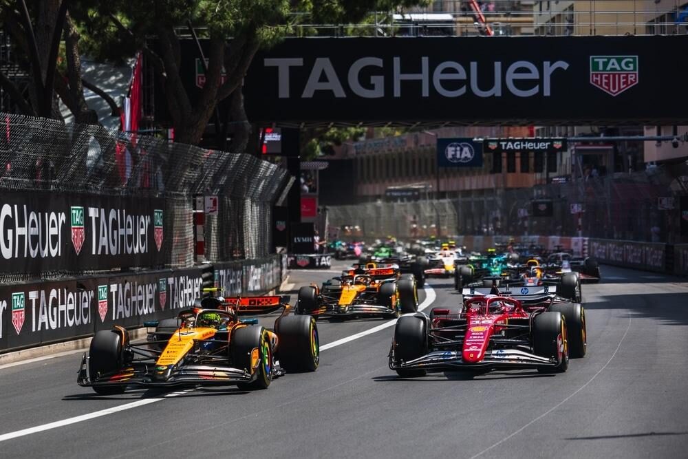 Supercars along the Monaco harbourfront during Grand Prix week