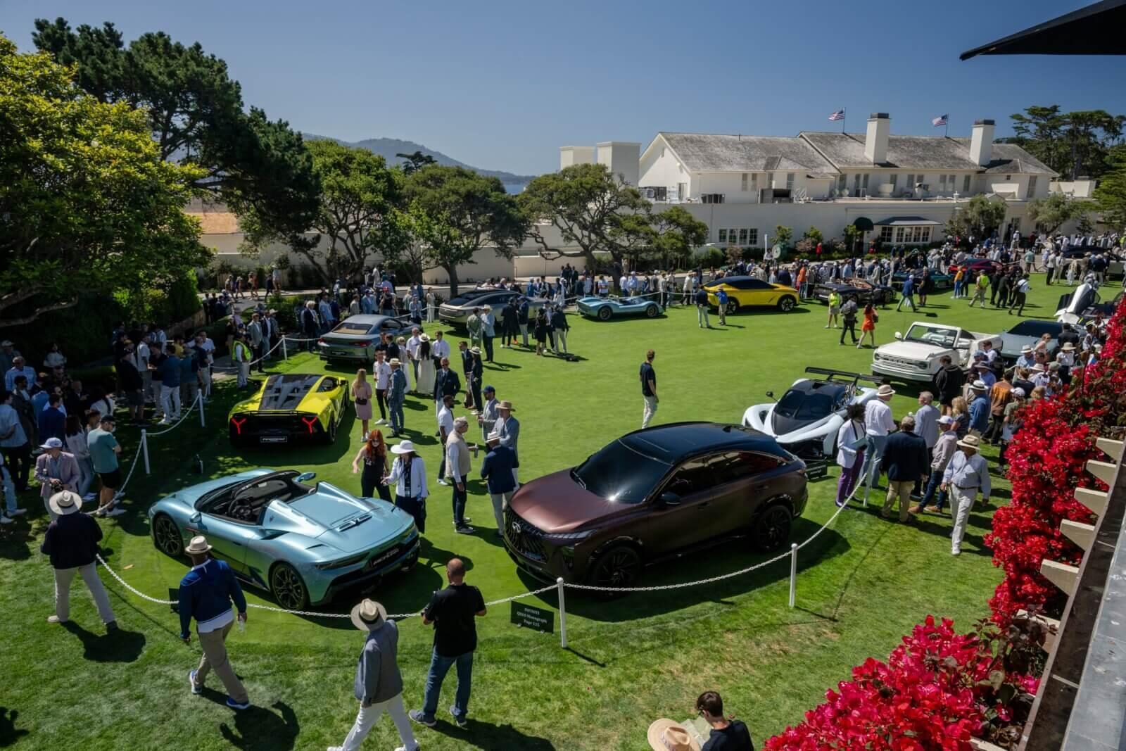 Collector cars and guests on the Pebble Beach concours field